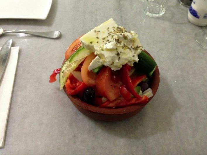 Giant salad arrives long before main course. I eventually start eating it. It’s mostly comprised of vegetables I don’t eat, and has no discernable dressing.